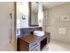 Bathroom featuring granite countertops with wood cabinets, tile floor, and modern fixtures at 3750 Las Vegas Blvd # 2407, Las Vegas, NV 89158