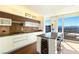 Modern kitchen with stainless steel appliances, an island with seating, and city views at 3750 Las Vegas Blvd # 2407, Las Vegas, NV 89158