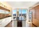 Gourmet kitchen with sleek countertops, island with wine storage, and panoramic city views at 3750 Las Vegas Blvd # 2407, Las Vegas, NV 89158