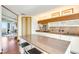 Contemporary kitchen featuring sleek cabinetry, a center island, and open floor plan at 3750 Las Vegas Blvd # 2407, Las Vegas, NV 89158