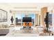 Comfortable living area with plush seating, modern decor, and a large TV for entertainment at 3750 Las Vegas Blvd # 2407, Las Vegas, NV 89158