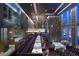 Elegant restaurant with stylish decor, a wine display, and city views through large windows at 3750 Las Vegas Blvd # 2407, Las Vegas, NV 89158