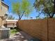 Backyard featuring a small green space, a patio, and a swing with seating at 4256 Perfect Drift St, Las Vegas, NV 89129