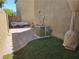 Backyard featuring brick pavers, artificial turf, and an outdoor seating area at 4256 Perfect Drift St, Las Vegas, NV 89129