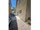 This backyard features a grill, a jacuzzi, a seating area and a paved patio at 4256 Perfect Drift St, Las Vegas, NV 89129