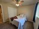 Comfortable bedroom featuring a ceiling fan, carpet, and a sliding door closet at 4256 Perfect Drift St, Las Vegas, NV 89129