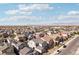 A scenic aerial view showcases the expansive neighborhood, mountain views, and vast blue sky with scattered clouds at 4347 Outlook Vista Ave, North Las Vegas, NV 89084