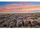 A captivating aerial view of a neighborhood with homes featuring diverse roof styles at 4347 Outlook Vista Ave, North Las Vegas, NV 89084