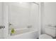 Full bathroom with white subway tile and shower-tub combination with a toilet at 4347 Outlook Vista Ave, North Las Vegas, NV 89084