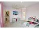 Spacious bedroom with cloud decor, a TV, and a well-organized walk-in closet at 4347 Outlook Vista Ave, North Las Vegas, NV 89084