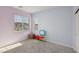 Comfortable bedroom with large windows and playful decor at 4347 Outlook Vista Ave, North Las Vegas, NV 89084