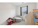 Bedroom featuring a gray chair, play house, and a window view at 4347 Outlook Vista Ave, North Las Vegas, NV 89084