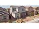 Two-story home featuring a brick-paved driveway, gray stucco, a two-car garage, and desert landscaping at 4347 Outlook Vista Ave, North Las Vegas, NV 89084