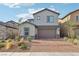 Charming two-story home with brick driveway and landscaped front yard, ideal for families at 4347 Outlook Vista Ave, North Las Vegas, NV 89084