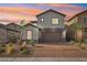 Charming two-story home featuring a brick driveway and well-manicured landscaping at 4347 Outlook Vista Ave, North Las Vegas, NV 89084