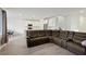 Open-concept living space with a large sectional sofa and dining area at 4347 Outlook Vista Ave, North Las Vegas, NV 89084