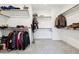 The spacious walk-in closet offers ample storage with shelving and racks for organized wardrobe at 4347 Outlook Vista Ave, North Las Vegas, NV 89084