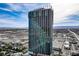 Stunning aerial view of a high-rise condo building in the city with gorgeous skyline and mountain views at 4381 W Flamingo Rd # 27308, Las Vegas, NV 89103