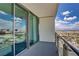 Balcony view of Las Vegas; includes railings, glass doors, skyline, and parking lot at 4381 W Flamingo Rd # 27308, Las Vegas, NV 89103