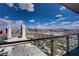 Striking city view from a high-rise featuring modern architecture against a blue sky with scattered clouds at 4381 W Flamingo Rd # 27308, Las Vegas, NV 89103