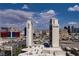Dynamic city view with landmark buildings set against a backdrop of clear blue skies and scattered clouds at 4381 W Flamingo Rd # 27308, Las Vegas, NV 89103