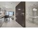Bright condo featuring tile floors, modern lighting, and convenient access to the bathroom and bedroom at 4381 W Flamingo Rd # 27308, Las Vegas, NV 89103