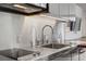 Modern kitchenette with stainless steel appliances and sleek cabinets at 4381 W Flamingo Rd # 27308, Las Vegas, NV 89103