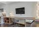Bright living space featuring hardwood floors, a large desk/workspace, and modern lighting at 4381 W Flamingo Rd # 27308, Las Vegas, NV 89103