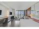 Bright and airy main bedroom with hardwood floors, balcony access and city views at 4381 W Flamingo Rd # 27308, Las Vegas, NV 89103