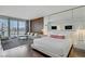 Bright and airy main bedroom with hardwood floors, accent wall, balcony access and city views at 4381 W Flamingo Rd # 27308, Las Vegas, NV 89103