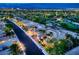 Aerial view of a well-manicured community featuring palm trees and views of a golf course at 4564 Bersaglio St, Las Vegas, NV 89135