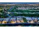 Breathtaking aerial view of a golf course community at night, featuring lush greenery and city skyline at 4564 Bersaglio St, Las Vegas, NV 89135