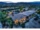 Beautiful aerial view of a home and community at twilight with mountain views in the distance at 4564 Bersaglio St, Las Vegas, NV 89135