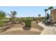 Expansive backyard with golf course views, landscaped grounds, and a comfortable seating area at 4564 Bersaglio St, Las Vegas, NV 89135
