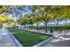 Bocce ball court offering a pleasant outdoor activity, surrounded by lush greenery and shaded seating areas at 4564 Bersaglio St, Las Vegas, NV 89135