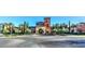 Elegant community clubhouse exterior with vibrant landscaping, portico entrance and a welcoming arrival area at 4564 Bersaglio St, Las Vegas, NV 89135
