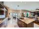 Gourmet kitchen with granite countertops, a center island, and views of the backyard at 4564 Bersaglio St, Las Vegas, NV 89135