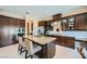 Modern kitchen featuring a large island, stainless steel appliances, and custom cabinetry at 4564 Bersaglio St, Las Vegas, NV 89135