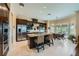 Spacious kitchen featuring dark wood cabinets, granite countertops, and stainless steel appliances at 4564 Bersaglio St, Las Vegas, NV 89135