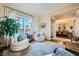 Bright living room with large windows, hardwood floors, and elegant decor at 4564 Bersaglio St, Las Vegas, NV 89135