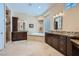 Luxurious main bathroom with double vanities, a soaking tub, and a separate shower at 4564 Bersaglio St, Las Vegas, NV 89135