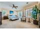 Serene main bedroom featuring a ceiling fan, plantation shutters, and ample natural light at 4564 Bersaglio St, Las Vegas, NV 89135