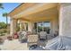 Inviting covered patio with comfortable seating, perfect for outdoor relaxation and entertaining with desert views at 4564 Bersaglio St, Las Vegas, NV 89135