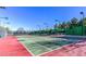 Tennis court provides a great recreational amenity, with well-maintained green surface and ample lighting at 4564 Bersaglio St, Las Vegas, NV 89135
