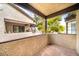 Outdoor patio with tile floor and partial view of community buildings at 5060 Jeffreys St # 201, Las Vegas, NV 89119
