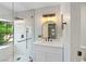 Modern bathroom featuring a glass shower with a rain shower head and a vanity with a marble countertop at 5060 Jeffreys St # 201, Las Vegas, NV 89119