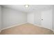 Neutral bedroom featuring carpet, ample natural light, and a closet at 5060 Jeffreys St # 201, Las Vegas, NV 89119