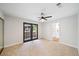 Spacious bedroom with ceiling fan and sliding glass doors to private balcony at 5060 Jeffreys St # 201, Las Vegas, NV 89119