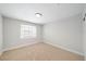 Cozy bedroom with neutral carpet, bright window, and ample natural light at 5060 Jeffreys St # 201, Las Vegas, NV 89119