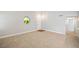 Welcoming entryway with neutral carpet, decorative window, and modern light fixtures at 5060 Jeffreys St # 201, Las Vegas, NV 89119